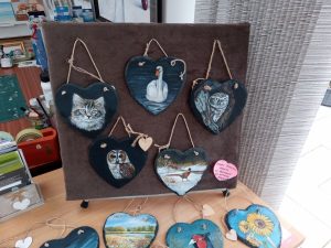 Some heart shaped hand painted slates